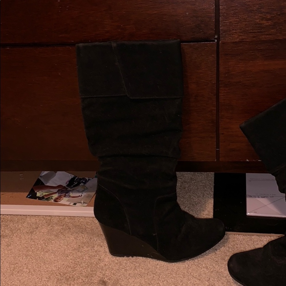Black clad high heeled boots